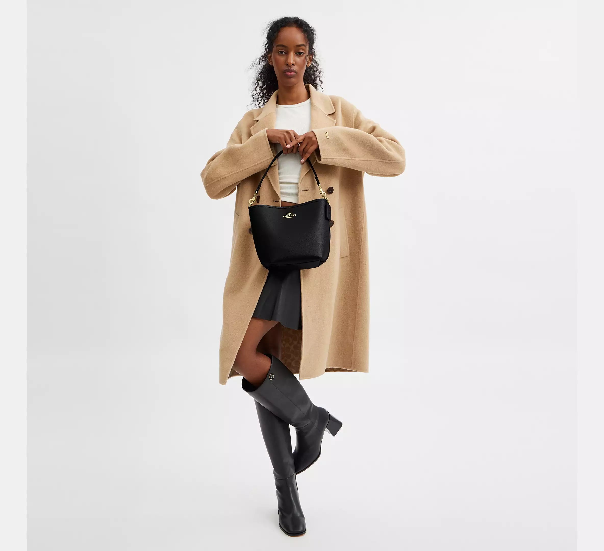 Coach bucket City Small en lona de firma Negra