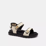 Sandalias Coach Negro y Blanco con Logo Dorado